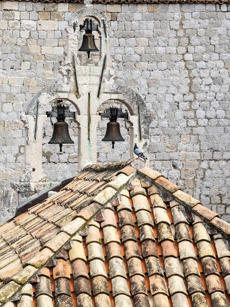 Croatia-Dubrovnik. Bell tower with three bells on top of the Church of Our Lady of Mt. Carmel.